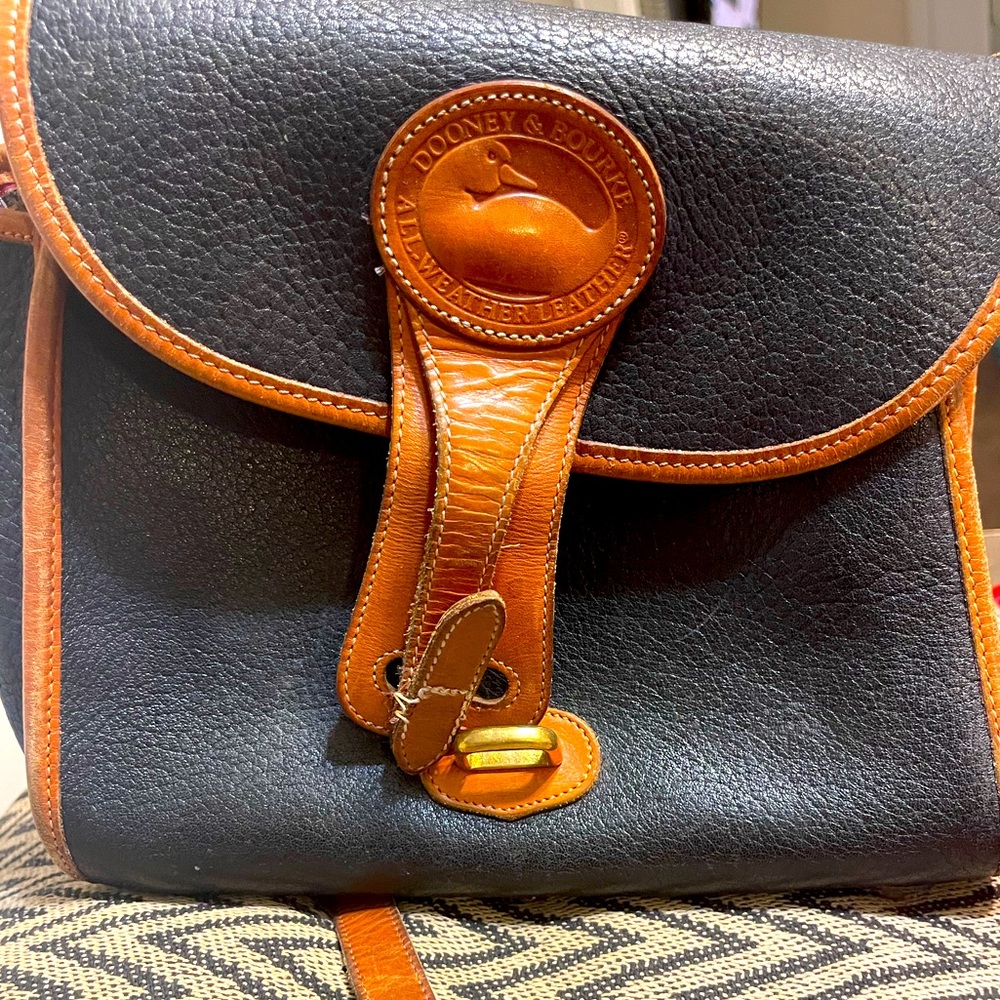 Vintage Dooney and Bourke crossbody bag. Used.